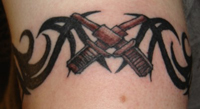 Cross Cannon Tribal Tattoo