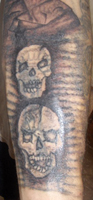 Two Skulls Cover Up Tattoo